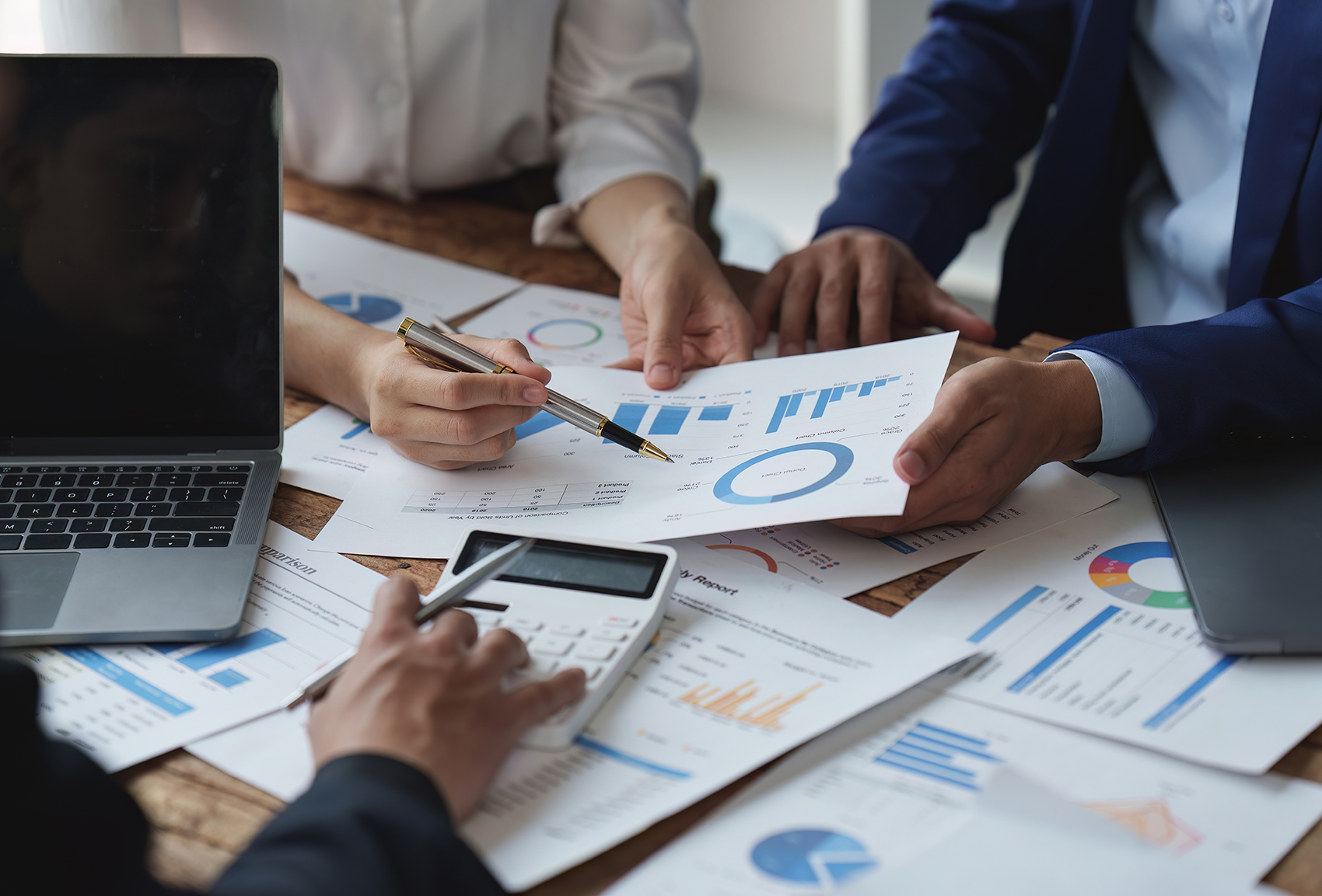 Nonprofit professionals view charts and graphs to plan for a comprehensive campaign